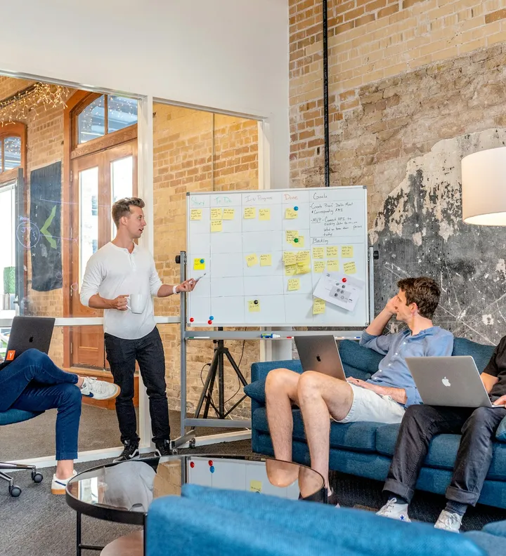 Startup team planning a technology roadmap on a whiteboard